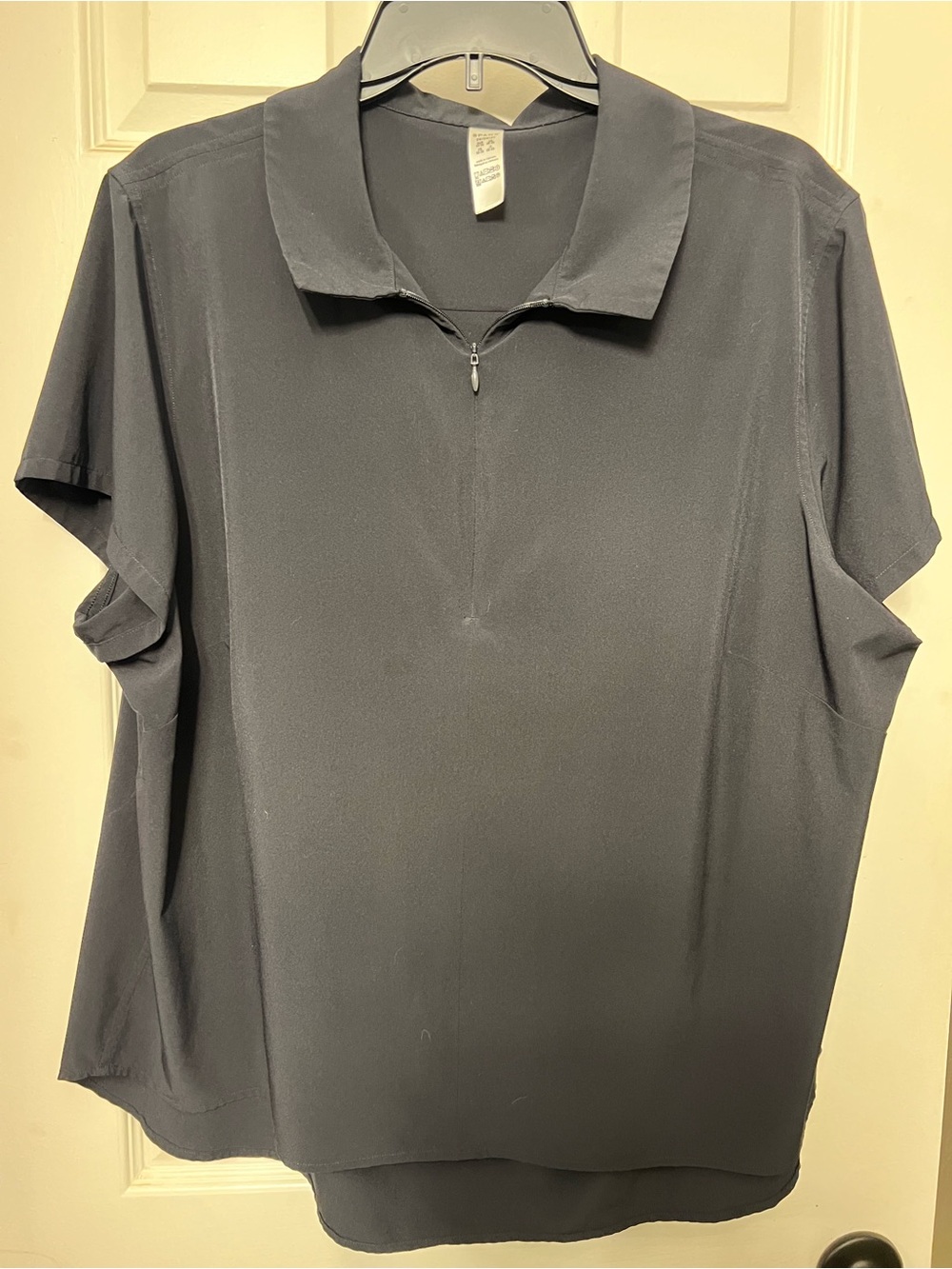 SPANX women’s Short-Sleeve Zip Polo — Black